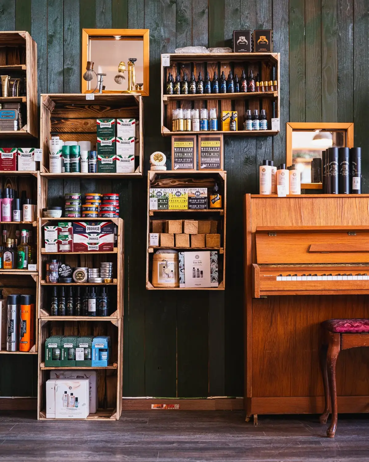 Shelves stocked with grooming products at a Malmö barbershop