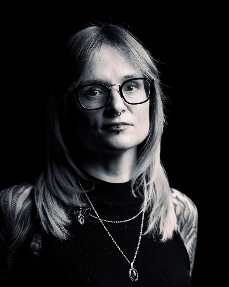 Black and white studio headshot of Christin